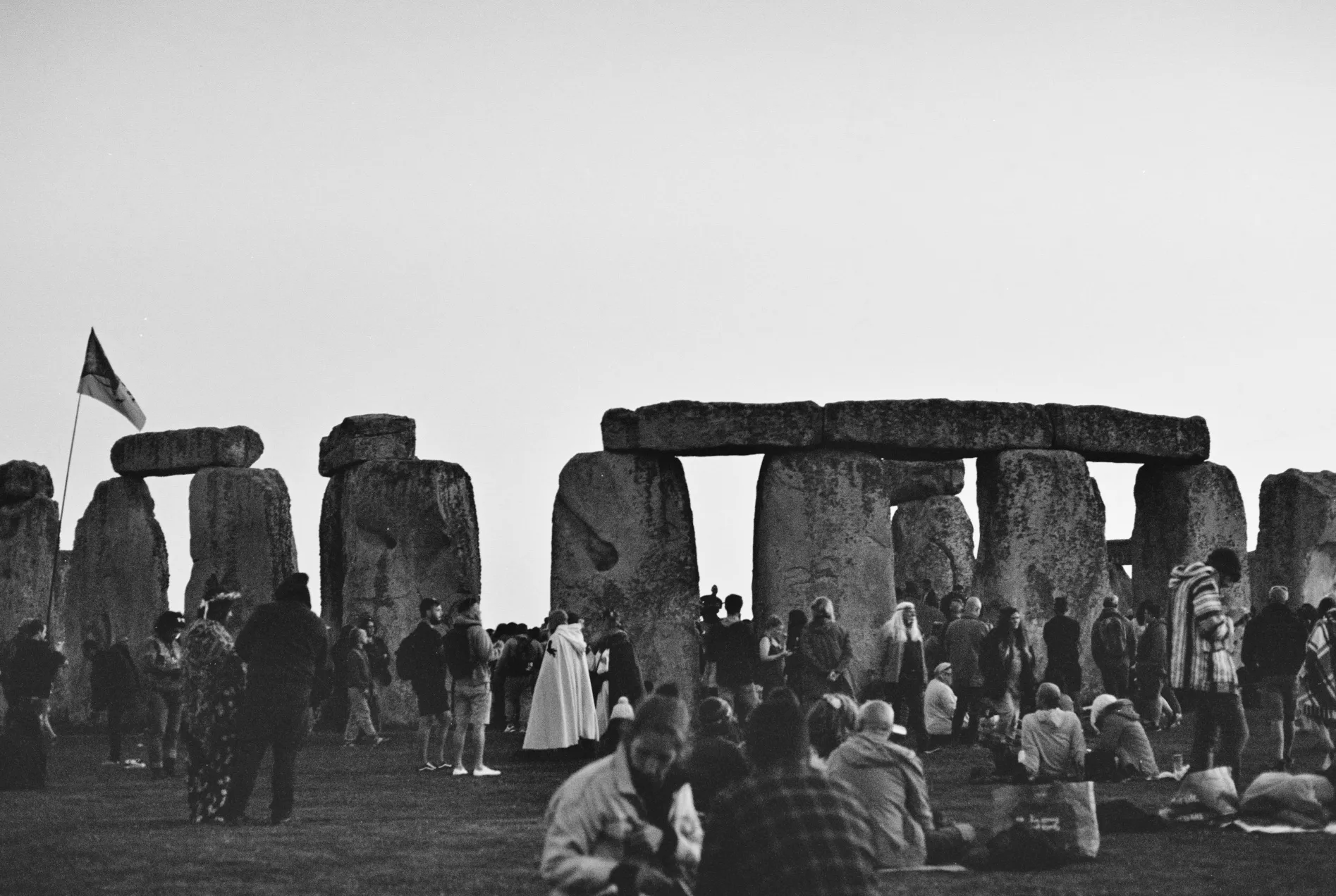 people circling the henge