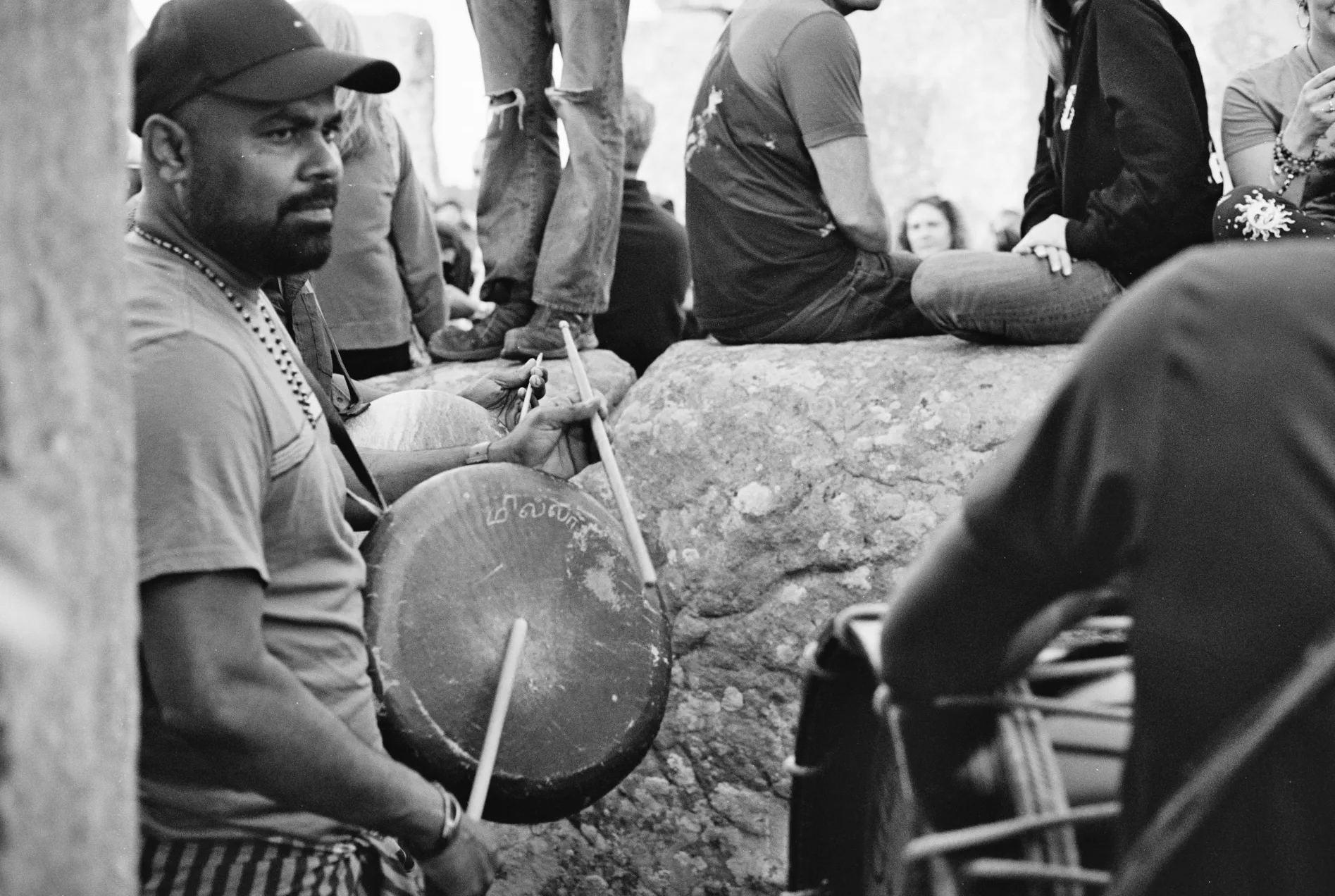 person playing traditional drum